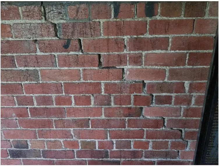 Example of a diagonal step or stair crack in a masonry wall. The crack takes the path of least resistance between brick units which is a zigzag form where the mortar joint bonds each brick together.