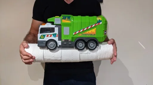 Adding a compressive force at either end of the toilet roll system ensures that no net tension exists while it is bending. Tension capacity has not been added to the system but rather the need for tension capacity has been removed.