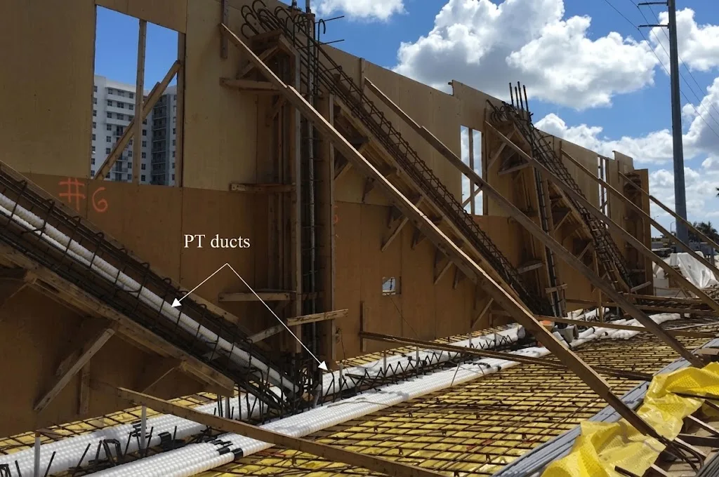 Image of the FIU bridge main span truss during construction showing reinforcing, PT rods and PT cables.