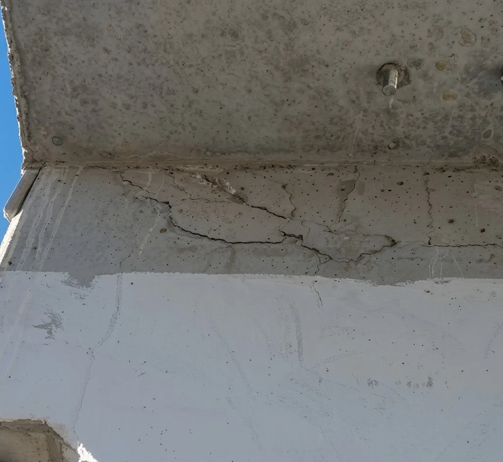 PHOTO 1 – Evidence of cracking at the FIU Pedestrian bridge after shoring was removed (refer later for location identified on elevation)