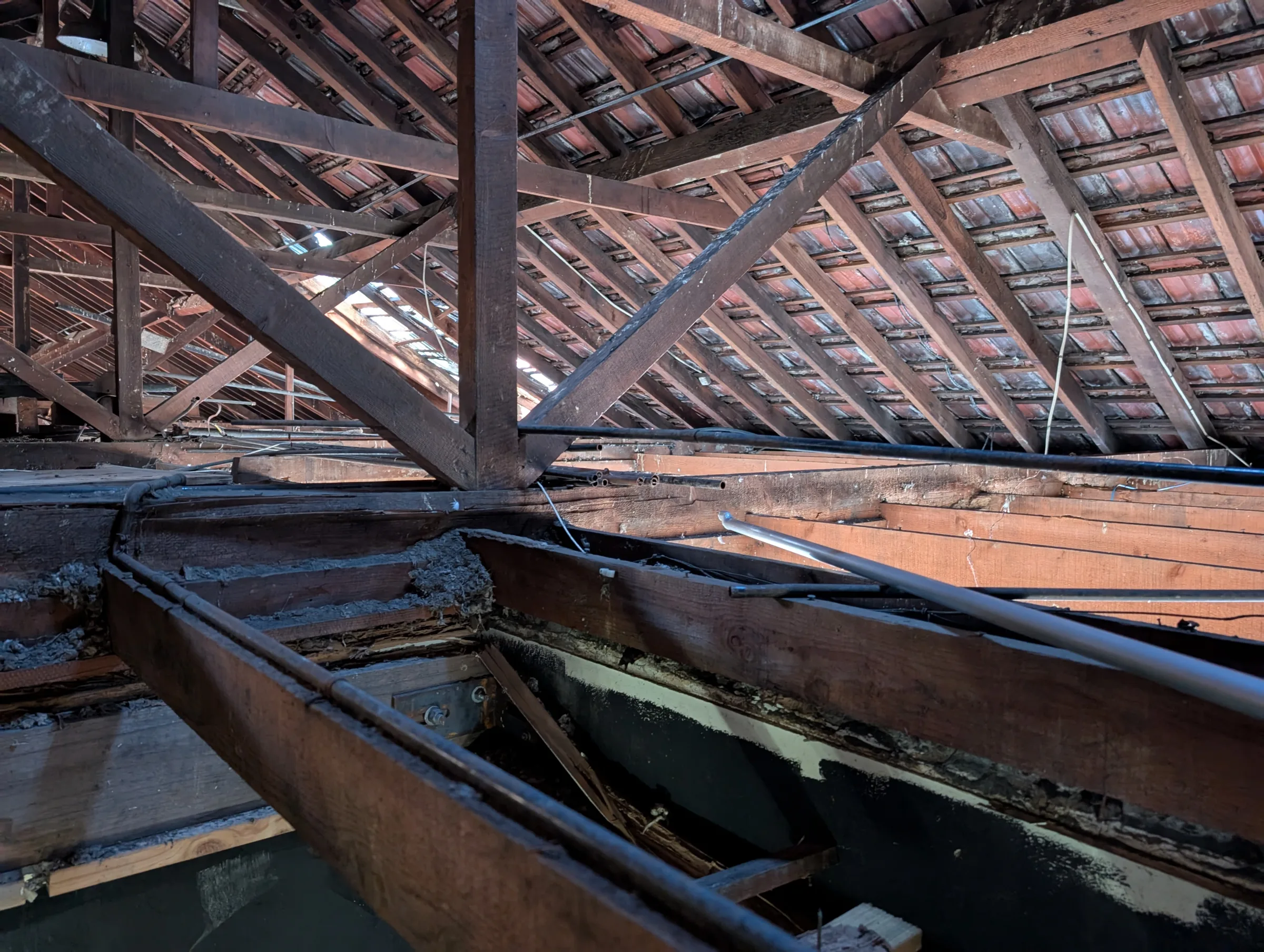 The extensive roof framing that required detailed assessment
