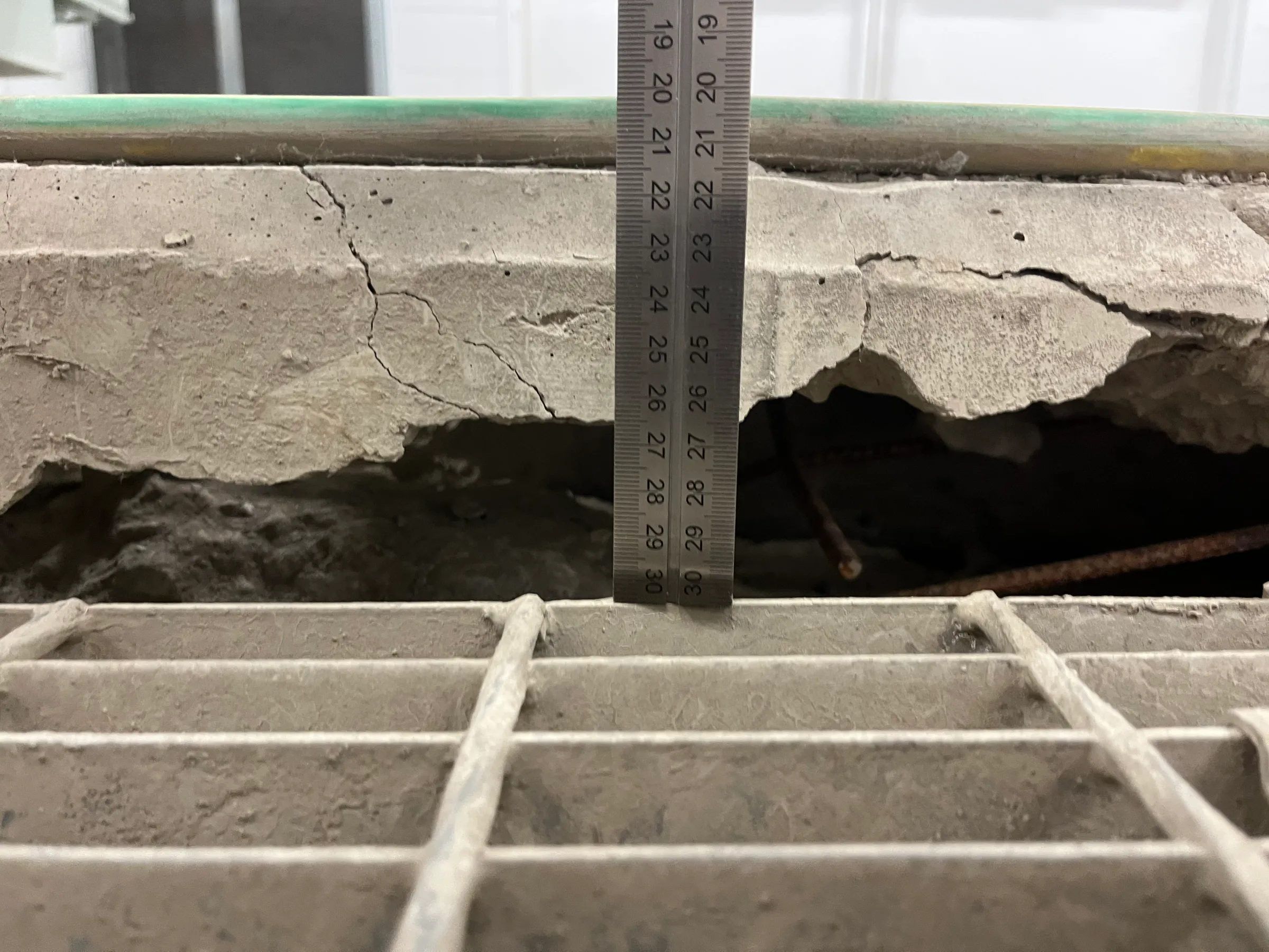 Significant slab displacement immediately raised concerns about the cause of movement and whether the condition was ongoing.