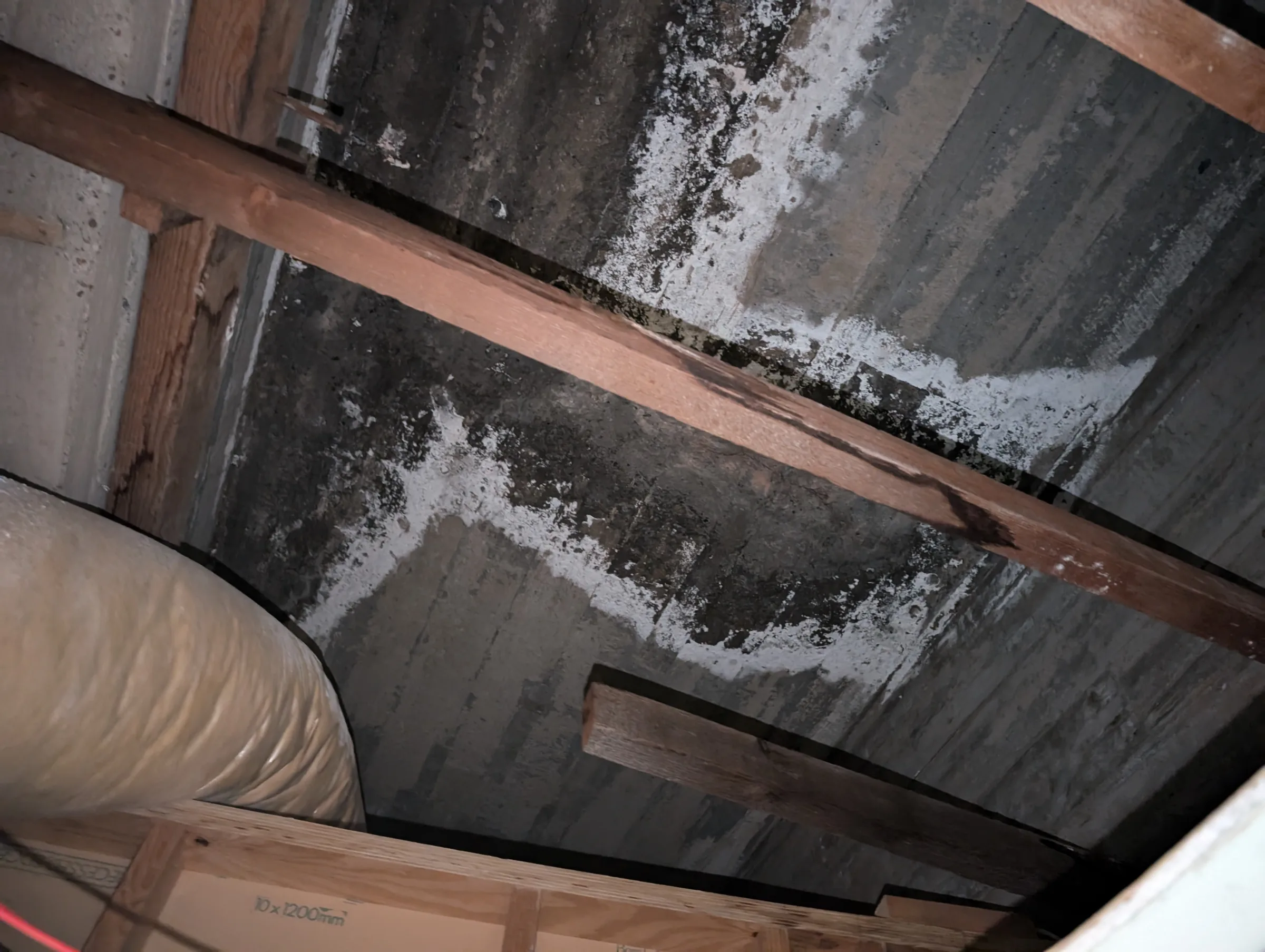 Evidence of water ingress through an existing concrete slab