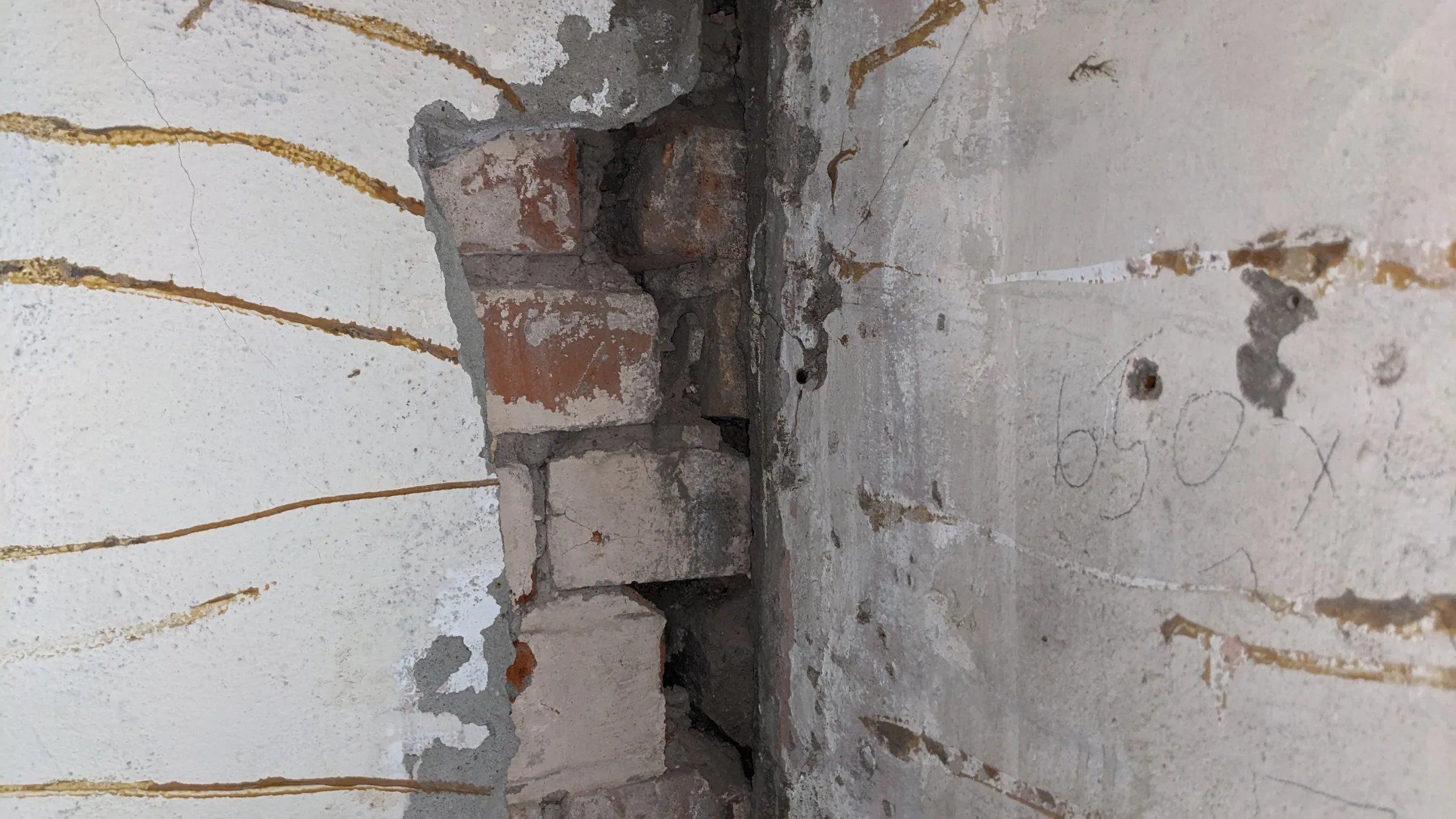 Cracking and movement were visible symptoms of much deeper structural issues.