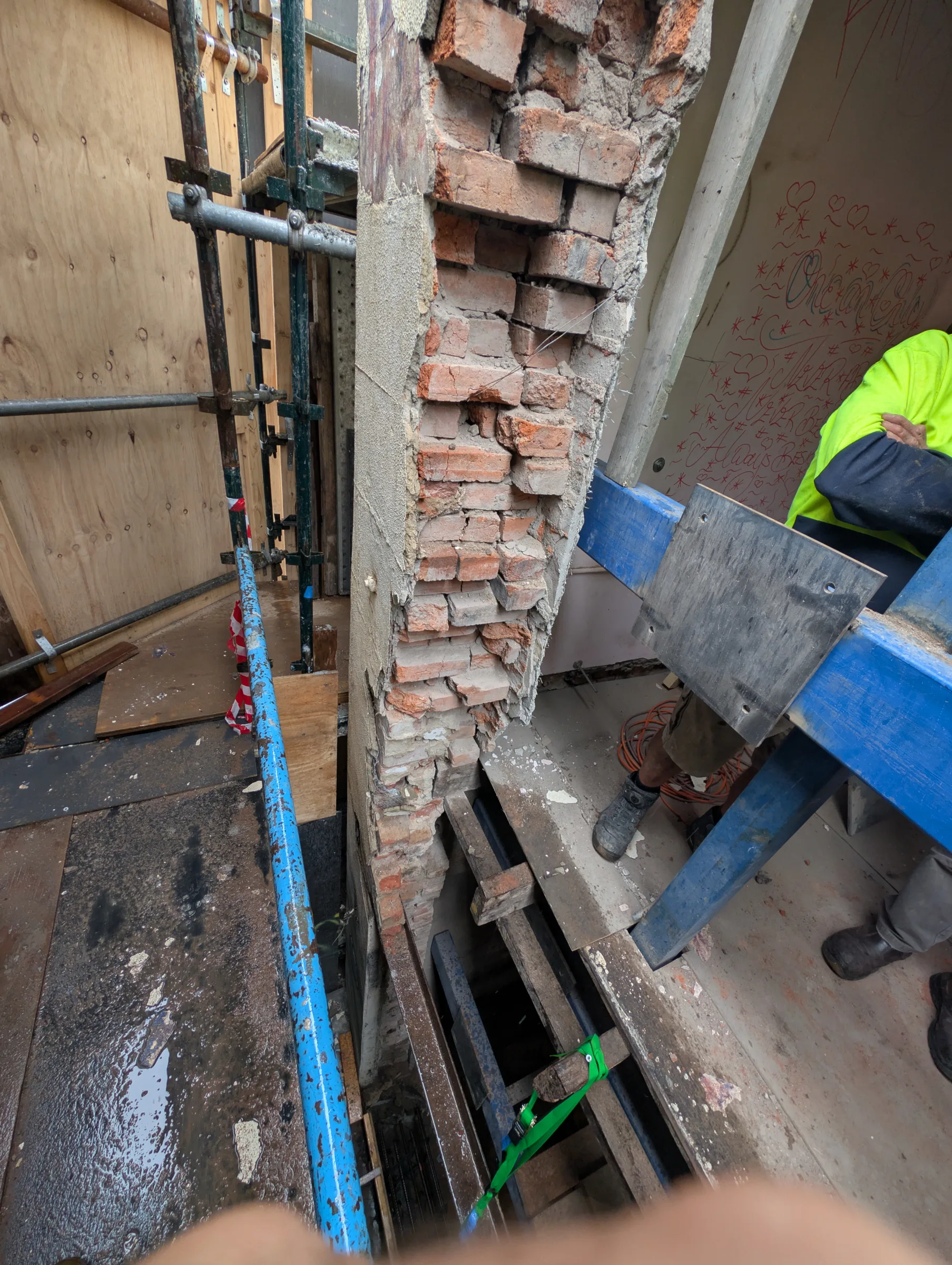 Inspection of the masonry wall cross-section revealed thick and stiff/solid render, likely performing much better than the interior masonry