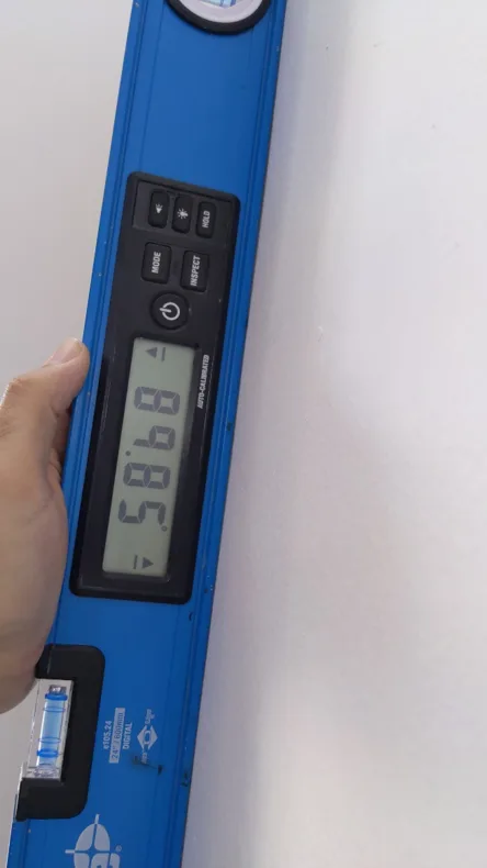 Measuring the wall to determine whether significant movement had occurred.