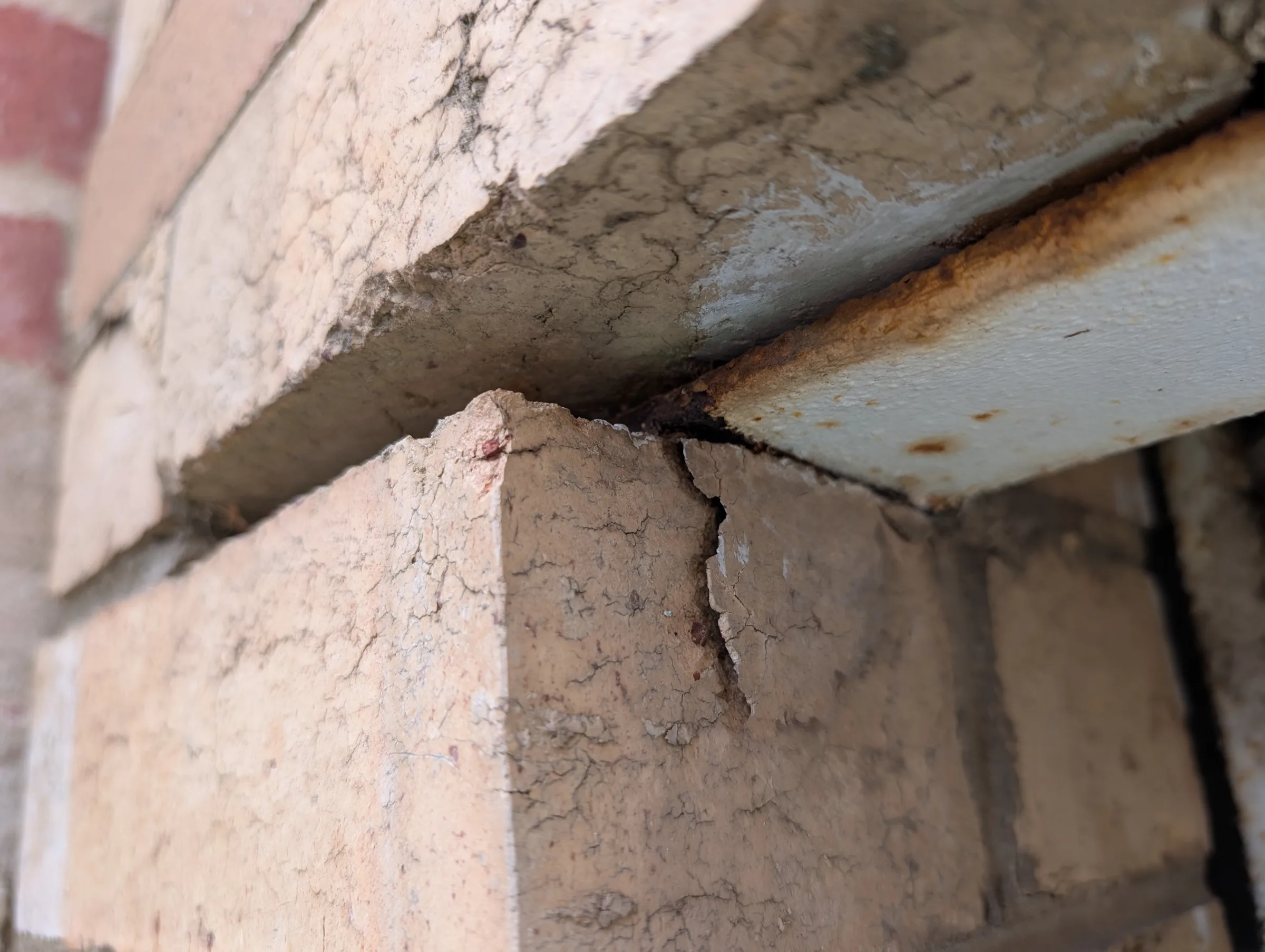 Corrosion of the steel lintel causing separation of the surrounding brickwork.