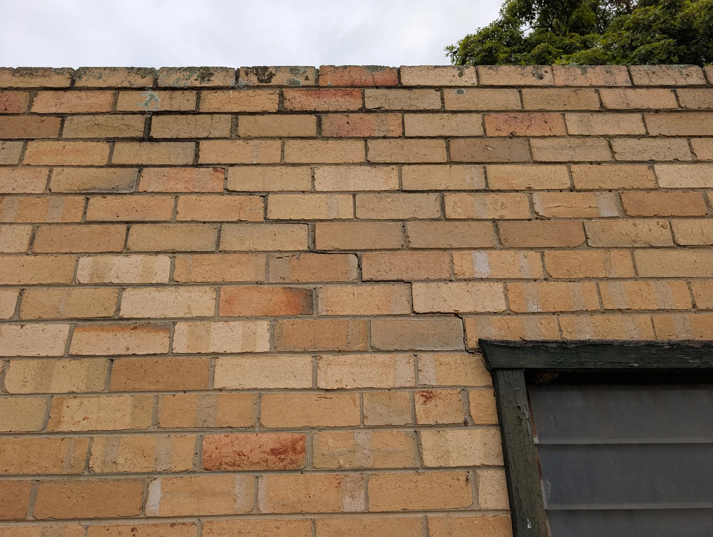 Typical step cracking associated with a corroding lintel.